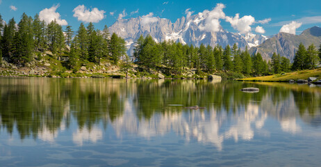 Wall Mural - The panorama of Grand Jorasses massif over the Lago d Arpy lake.