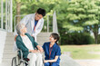 © buritora - 病院・介護施設にいる車椅子に乗った高齢者と医師・看護師