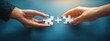 © Margarita - Collaboration Hands Connecting Puzzle Pieces for Business Solutions and Strategy