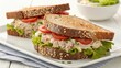 © Yuwadee - Two Delicious Chicken Salad Sandwiches on Multigrain Bread with Lettuce and Tomato