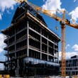 © BOJOShop - Construction Site  Modern Building Under Construction with Crane