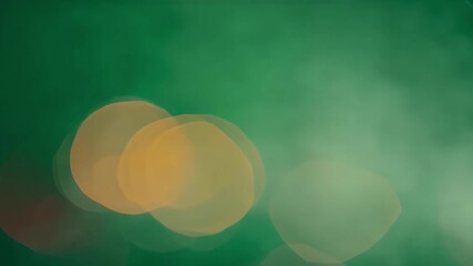 Sticker - A blurred green background with bright yellow and red lights in the foreground creates a visually vibrant and dreamlike aesthetic