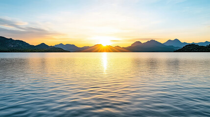 Sticker - serene sunrise reflected in calm lake, surrounded by mountains