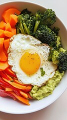 Wall Mural - Vibrant vegetable bowl with fried egg and guacamole