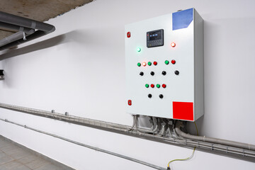 Poster - Control panel mounted on wall in a modern industrial facility with various buttons and indicators