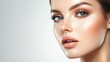 © Plaifah - Detailed shot of a woman with perfect makeup application, including defined brows, radiant foundation, and glossy lips, emphasizing her polished beauty.