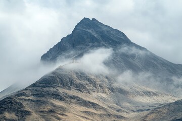 Aufkleber - A misty mountain scene with thick fog and clouds covering the peak