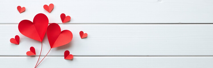 Poster - A Minimalist Design Features Small Red Paper Hearts Against A White Wooden Background, Ideal For A Postcard Or Love Message. 00002