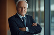 © Yurii Levko - Elderly gentleman poses confidently in modern office setting