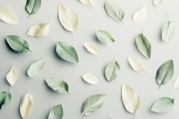 Poster - Minimalist abstract pattern of scattered leaves in soft sage green and cream on pale gray background