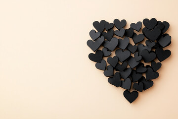 Poster - Black hearts forming a textured heart shape on a soft beige background, symbolizing love, Valentine's Day, unity, and minimalism with free space for text or design