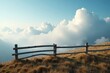 © dadtophoto - Abstract shapes of clouds and fog floating above a weathered wooden fence on a textured hillside, clouds, hills, outdoor