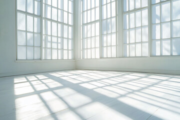 Wall Mural - Bright and airy interior space with large windows casting shadows on the white floor, ideal for photography