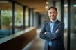 © Khawla - portrait of successful senior businessman consultant looking at camera and smiling inside modern office building