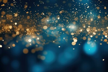 Poster - Golden particles falling and floating on a defocused blue background, creating a magical and festive atmosphere