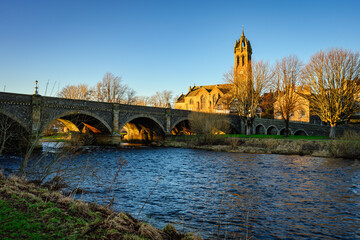 Wall Mural - peebles old parish church by the river tweed, which is 97 miles long from source to estuary and runs