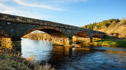Wall Mural - old road bridge over river tweed at peebles. the river tweed is 97 miles long from source to estuary
