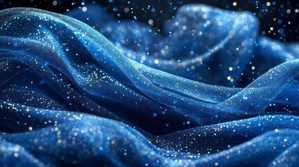 Glittering blue fabric waves, dark background, bokeh