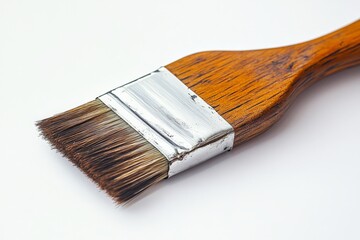 Poster - Wooden handled paintbrush with bristles resting on a white background
