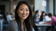 © AlfaSmart - Smiling Professional Woman in Modern Office Setting
