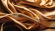 © astaszczyk - Golden flowing silk as a background.