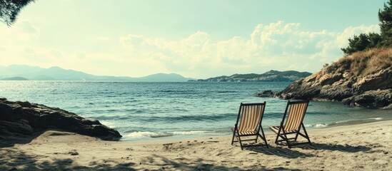 Wall Mural - Cozy Beach Chairs on Serene Island Vacation Scene with Calm Waters and Scenic Landscape Ideal for Travel and Leisure Promotions