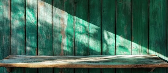 Poster - Rustic Green Wooden Shelf with Sunlight and Vintage Texture Ideal for Quotes or Messages in a Cozy Country Style Setting