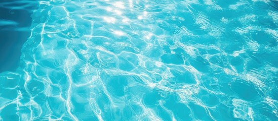 Poster - Serene blue swimming pool water reflecting sunlight under a clear sky evoking relaxation and tranquility with space for text or branding