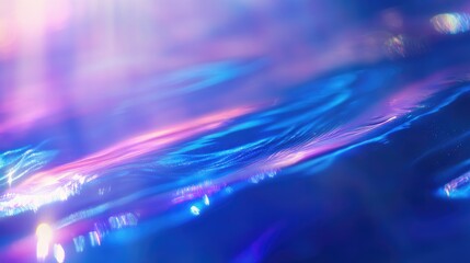 Vibrant blue light diffraction bokeh creating an abstract gradient backdrop with shimmering textures and visual depth