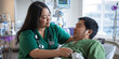 © Lila Patel - Nurse Attending to Patient in Hospital Room