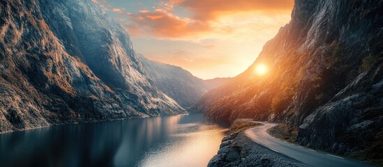Poster - Mountain Canyon Road at Sunset with Tranquil Water and Dramatic Landscape for Text Placement