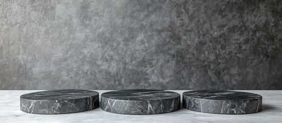 Poster - Elegant black stone podiums on marble textured background ideal for product display and promotional text with ample copyspace for customization