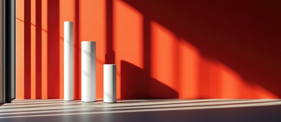 Poster - Minimalist design featuring white tubes against a vibrant red wall with dramatic shadows and ample copyspace for branding and messaging