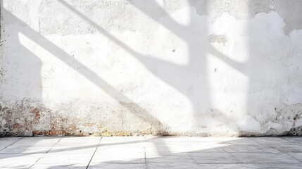 Poster - Natural sunlight creating shadows on an unfinished white concrete wall in a construction setting