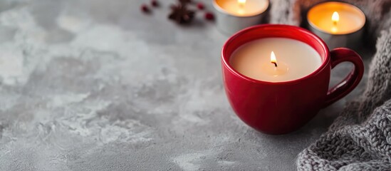 Poster - Red Cup with Soy Wax Candle and Cozy Text Space on Grey Background for Home Decor and Relaxation Themes