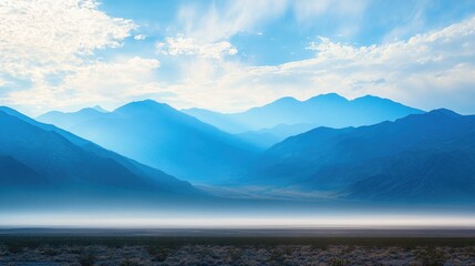 Aufkleber - Calm Desert Scene with Soft Blue Mountains Under a Bright Sky and Atmospheric Haze