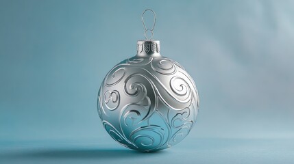 Poster - elegant solid silver christmas bauble with intricate pattern against soft light blue background