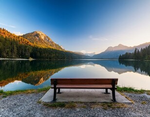 Wall Mural - serene lake view at dawn with a bench overlooking majestic mountains and calm waters perfect for relaxation