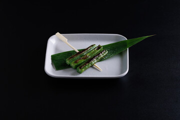 Wall Mural - Grilled Okra japanese food isolate in black background