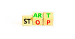 © Dzmitry - Start or stop symbol. Concept words Start or Stop on beautiful wooden block. Beautiful white table white background. Business start or stop concept. Copy space.