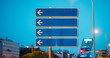 © ADDICTIVE STOCK - Downtown navigation with street sign pointing in multiple directions