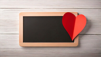 Wall Mural - Wooden Framed Blackboard with Red Paper Heart on White Wooden Background