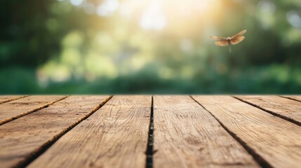 Poster - Sunlit wooden table near a pond creates a serene outdoor setting with a dragonfly hovering, evoking a peaceful and inviting atmosphere
