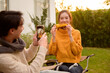 © tonefotografia - Couple Enjoys Grilling Outdoors in a Cozy Garden Setting During a Sunny Afternoon