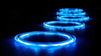Aufkleber - Glowing blue circles realistic set isolated on black background. Vector illustration of glowing neon rings with motion effect. Round trace of thunder energy swirling at high speed. Magic light