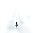 © ธนากร บัวพรหม - A lone rider journeys through a serene, foggy landscape, enveloped in a mystical white mist that evokes feelings of solitude and introspection.