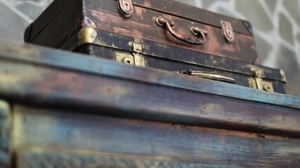 Poster - Two old suitcases stacked high, perfect for travel or storage.