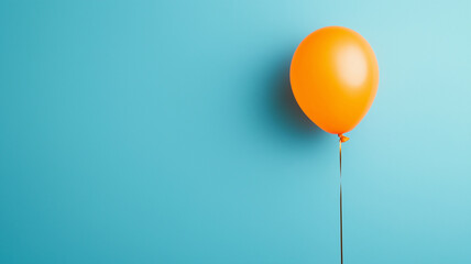 Wall Mural - vibrant orange balloon stands out against bright blue background, creating cheerful and playful atmosphere. simplicity of scene evokes feelings of joy and celebration