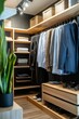 © Katavudh - Stylish and organized closet with suits and accessories displayed.