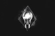 © Thanyarat - A simple design of a glowing light bulb surrounded by faint spark lines, symbolizing a greatly inspiring idea